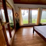 Cozy room with nature view window at Rosewood Stay, Coorg, Karnataka