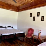 Cozy room with nature-inspired decor at Rosewood Stay, Coorg, Karnataka