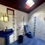 Luxurious bathroom with modern amenities at Rosewood Stay, Coorg, Karnataka