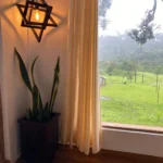 Inviting room with scenic nature vista at Rosewood Stay, Coorg